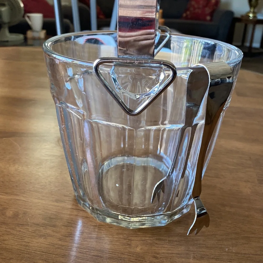 Vintage ice bucket. Mint condition With tongs. 6 3/4 in tall. 7 inches wide.